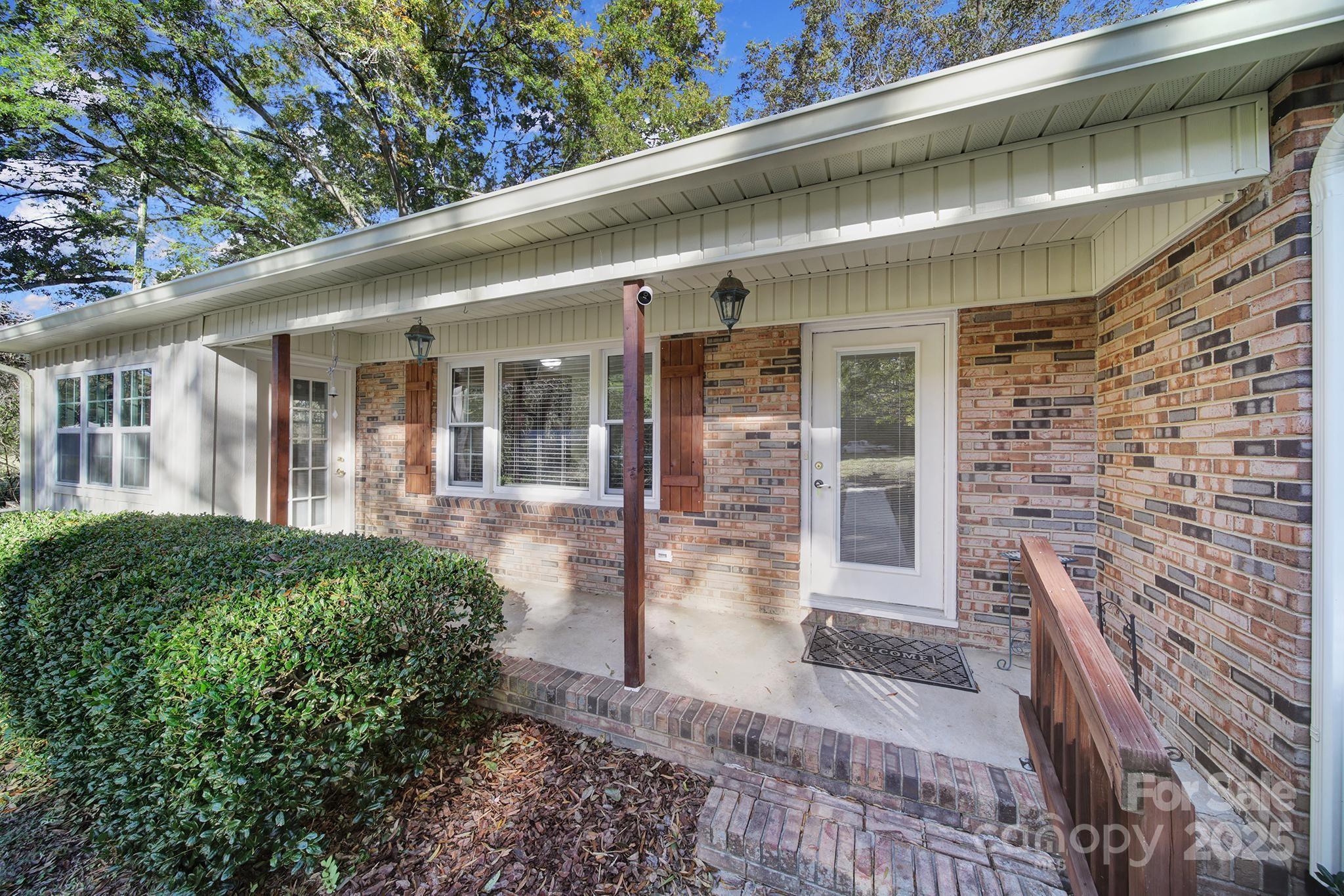 3987 Taxahaw Road Lancaster, SC 29720 - Photo 25 of 29 a view of a patio with table and chairs and potted plants