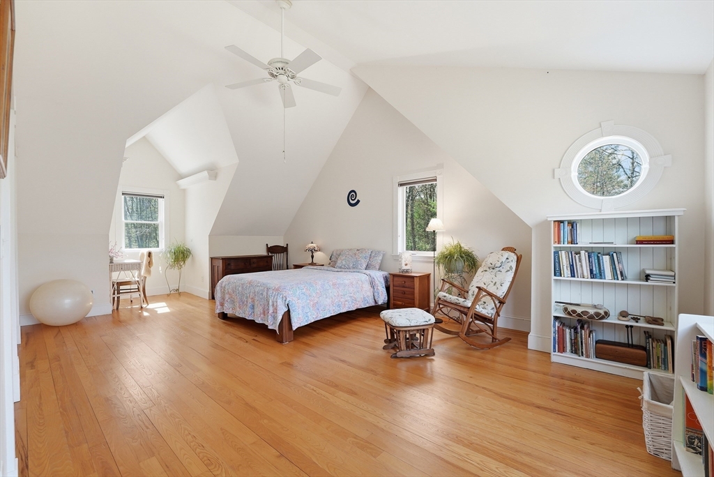 110 Turkey Hill Road Northampton, MA 01062 - Photo 16 of 42 a spacious bedroom with a bed and wooden floor