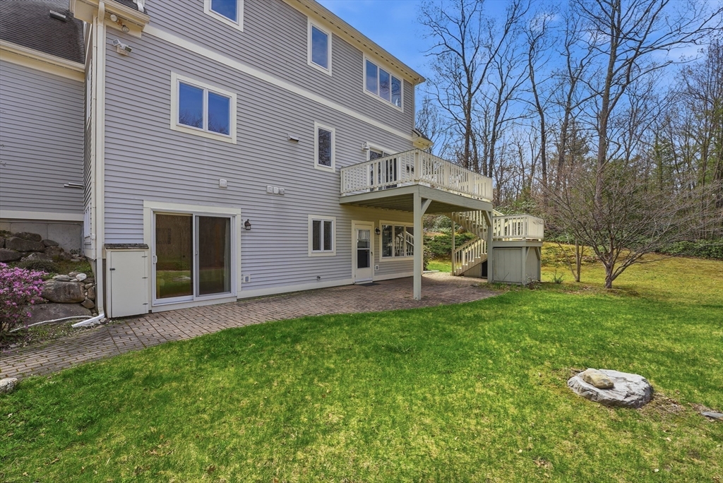 110 Turkey Hill Road Northampton, MA 01062 - Photo 28 of 42 a front view of a house with a garden and trees