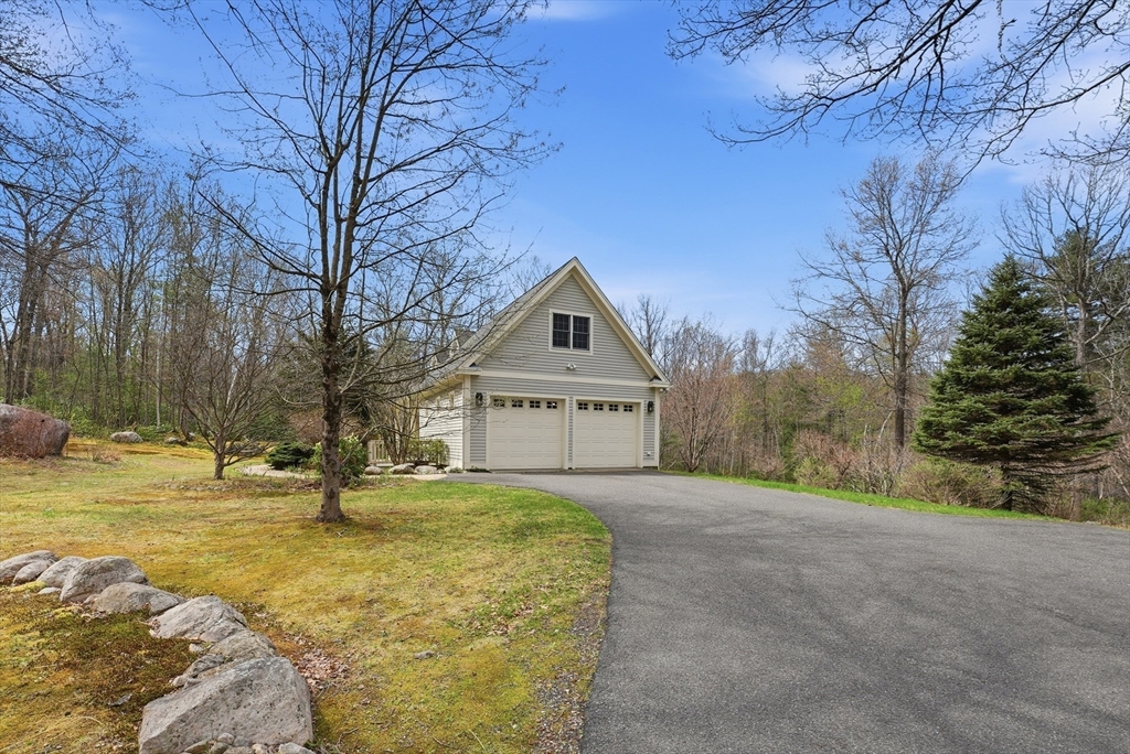 110 Turkey Hill Road Northampton, MA 01062 - Photo 36 of 42 a house with trees in front of it