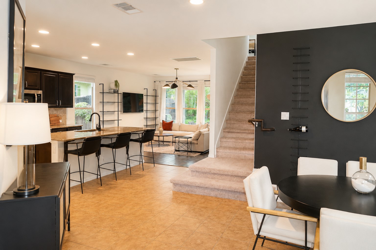 9929 Wading Pool Path Austin, TX 78748 - Photo 2 of 13 An inviting open-concept layout seamlessly connects the kitchen, living area, and dining space, fostering effortless entertaining.