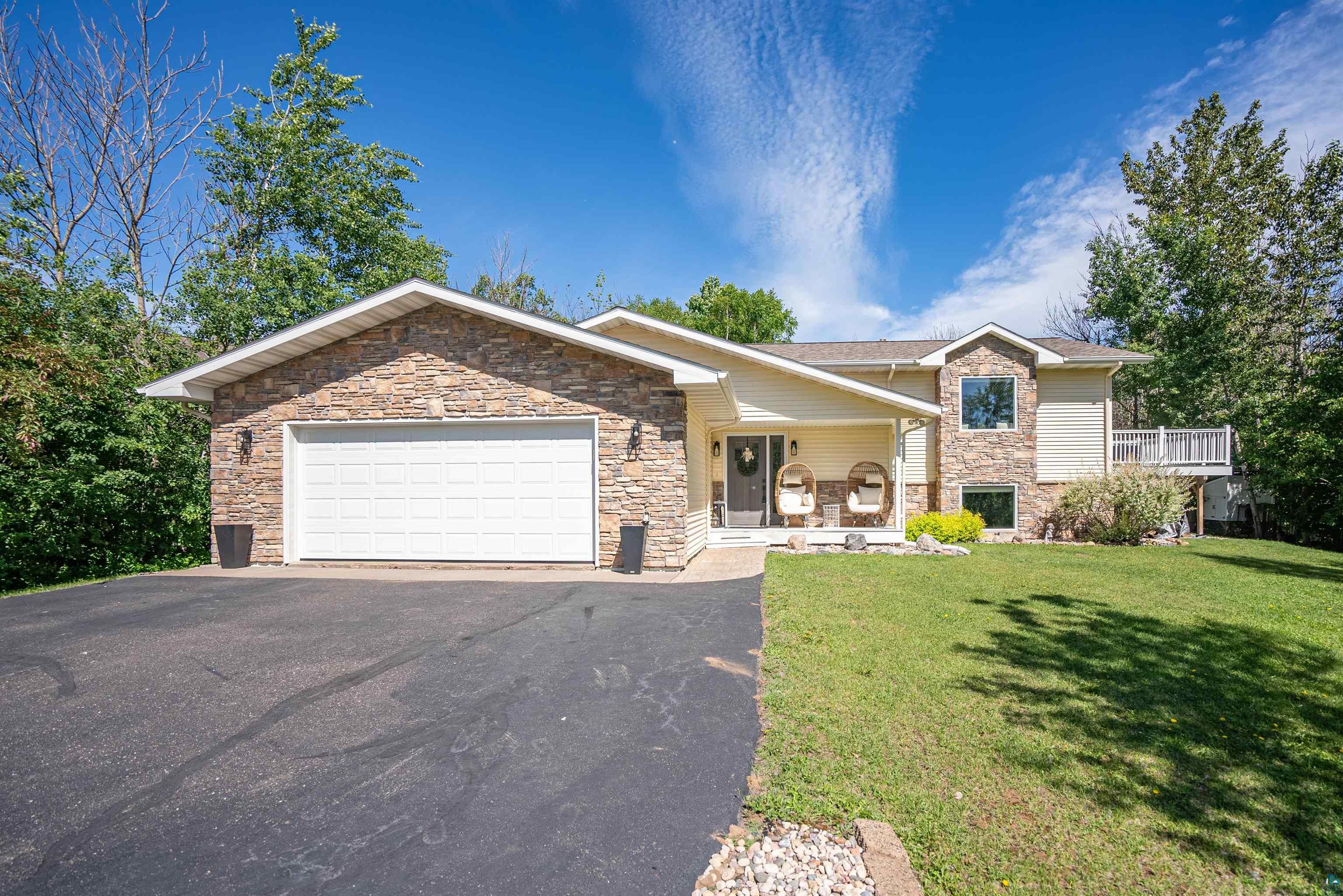 4809 Oak Ridge Drive Hermantown, MN 55811 - Photo 62 of 67 Stone veneer and siding exterior with an attached garage