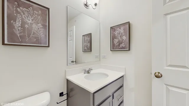 an empty room with a painting on the wall