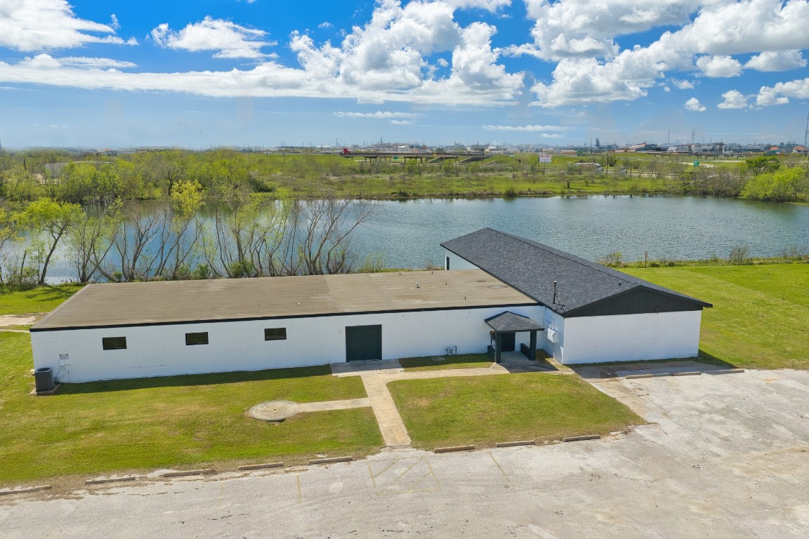 238 Johnson Cook Road Clute, TX 77531 - Photo 1 of 40 a view of a swimming pool with an outdoor space and seating area