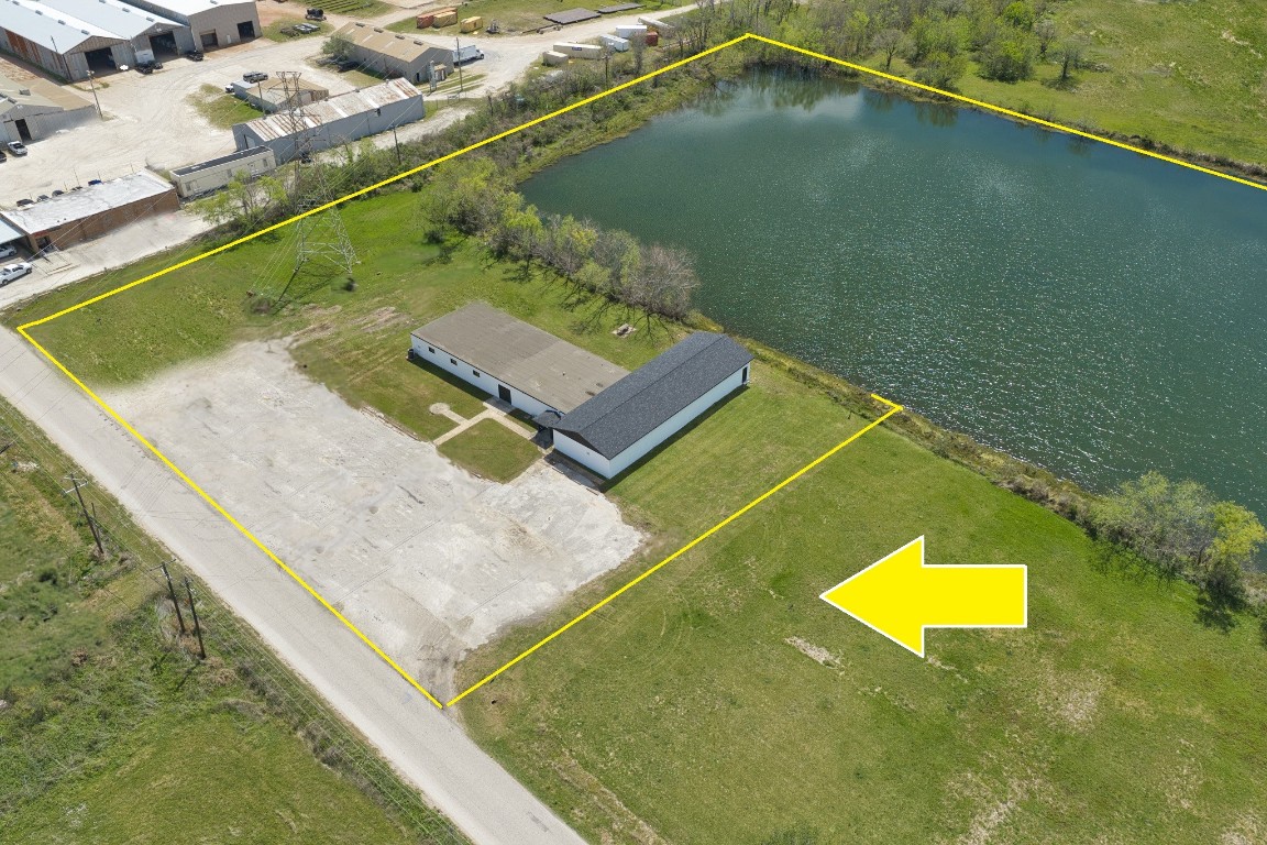 238 Johnson Cook Road Clute, TX 77531 - Photo 23 of 40 a view of a pool an outdoor space and a lake view