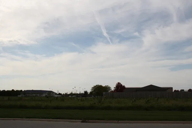 a view of sunset and city view