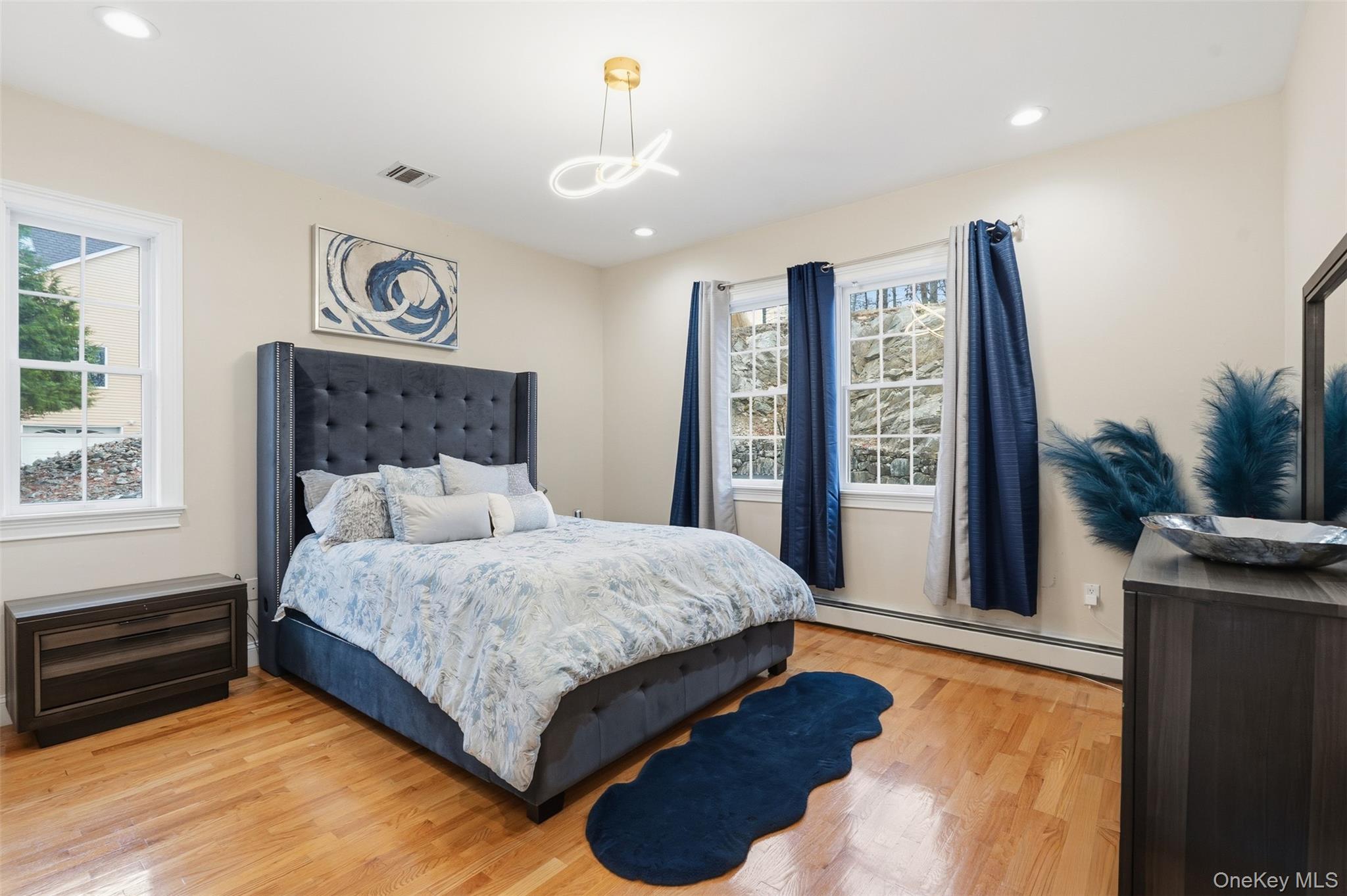 54 Pyngyp Road Stony Point, NY 10980 - Photo 15 of 28 Bedroom featuring wood finished floors, baseboard heating, and recessed lighting