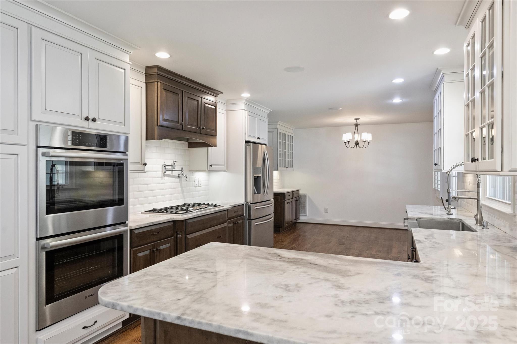 1008 Dumbarton Road Gastonia, NC 28054 - Photo 1 of 40 a kitchen with refrigerator a stove and cabinets