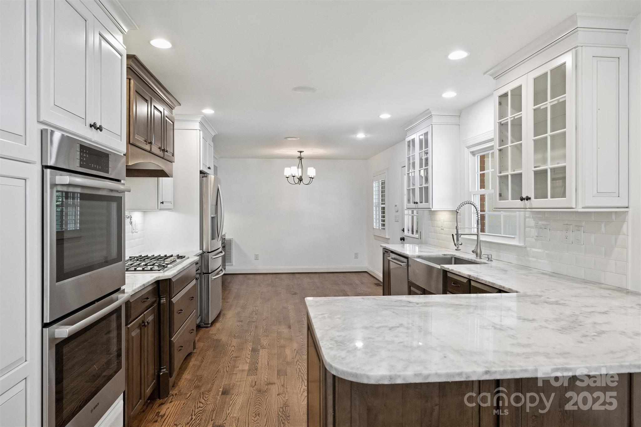 1008 Dumbarton Road Gastonia, NC 28054 - Photo 12 of 40 a kitchen with stainless steel appliances granite countertop a refrigerator a stove and a sink