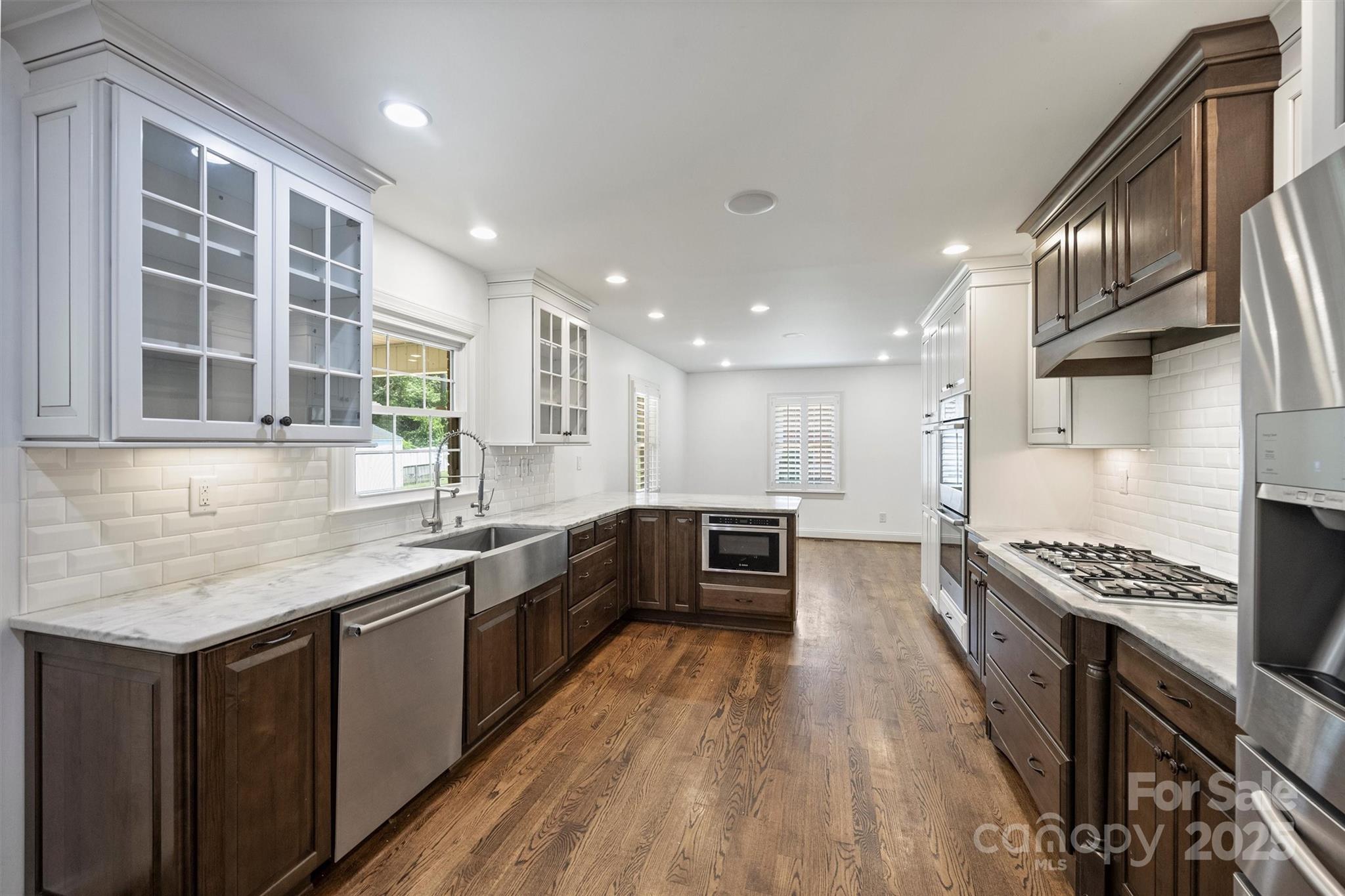 1008 Dumbarton Road Gastonia, NC 28054 - Photo 14 of 40 a kitchen with stainless steel appliances a sink stove and cabinets
