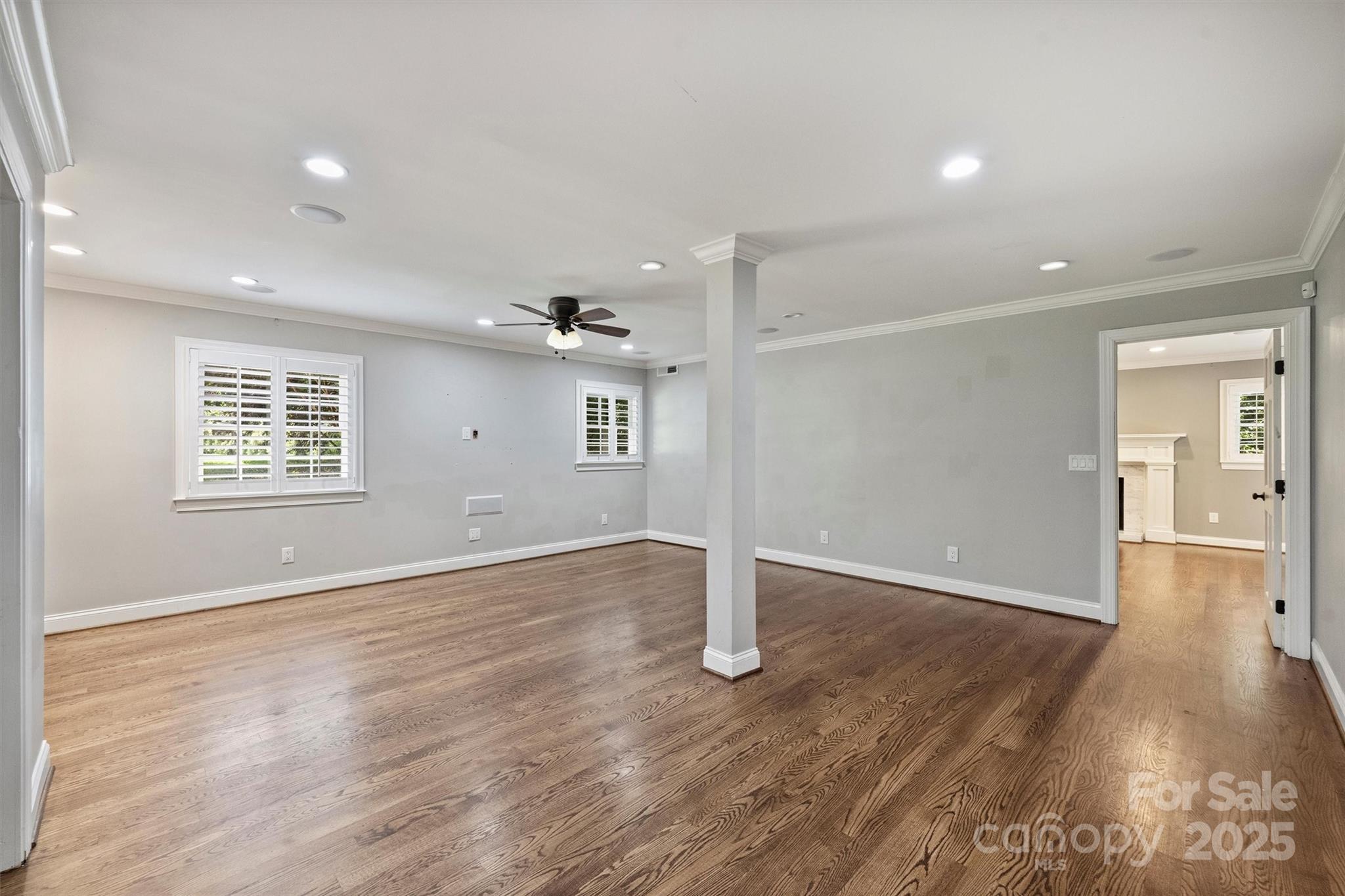 1008 Dumbarton Road Gastonia, NC 28054 - Photo 18 of 40 an empty room with wooden floor and windows