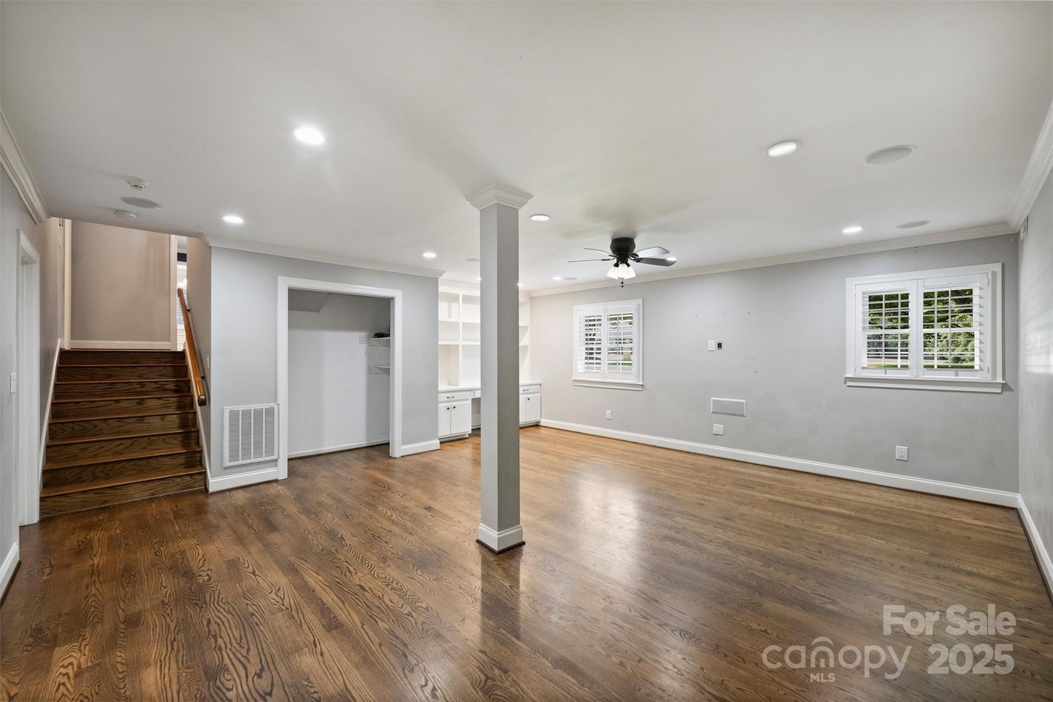 1008 Dumbarton Road Gastonia, NC 28054 - Photo 19 of 40 a view of an empty room with wooden floor and a window