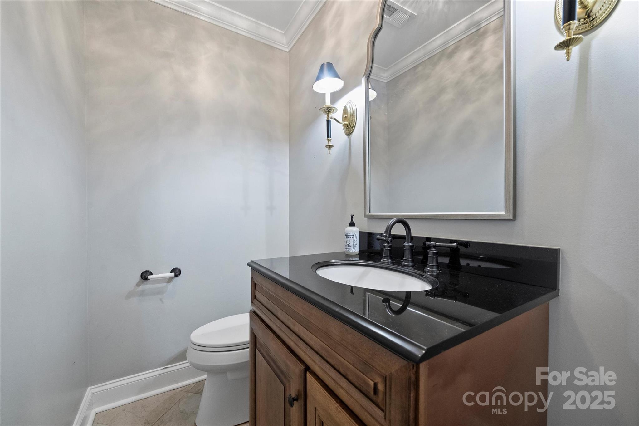 1008 Dumbarton Road Gastonia, NC 28054 - Photo 21 of 40 a bathroom with a sink and a toilet