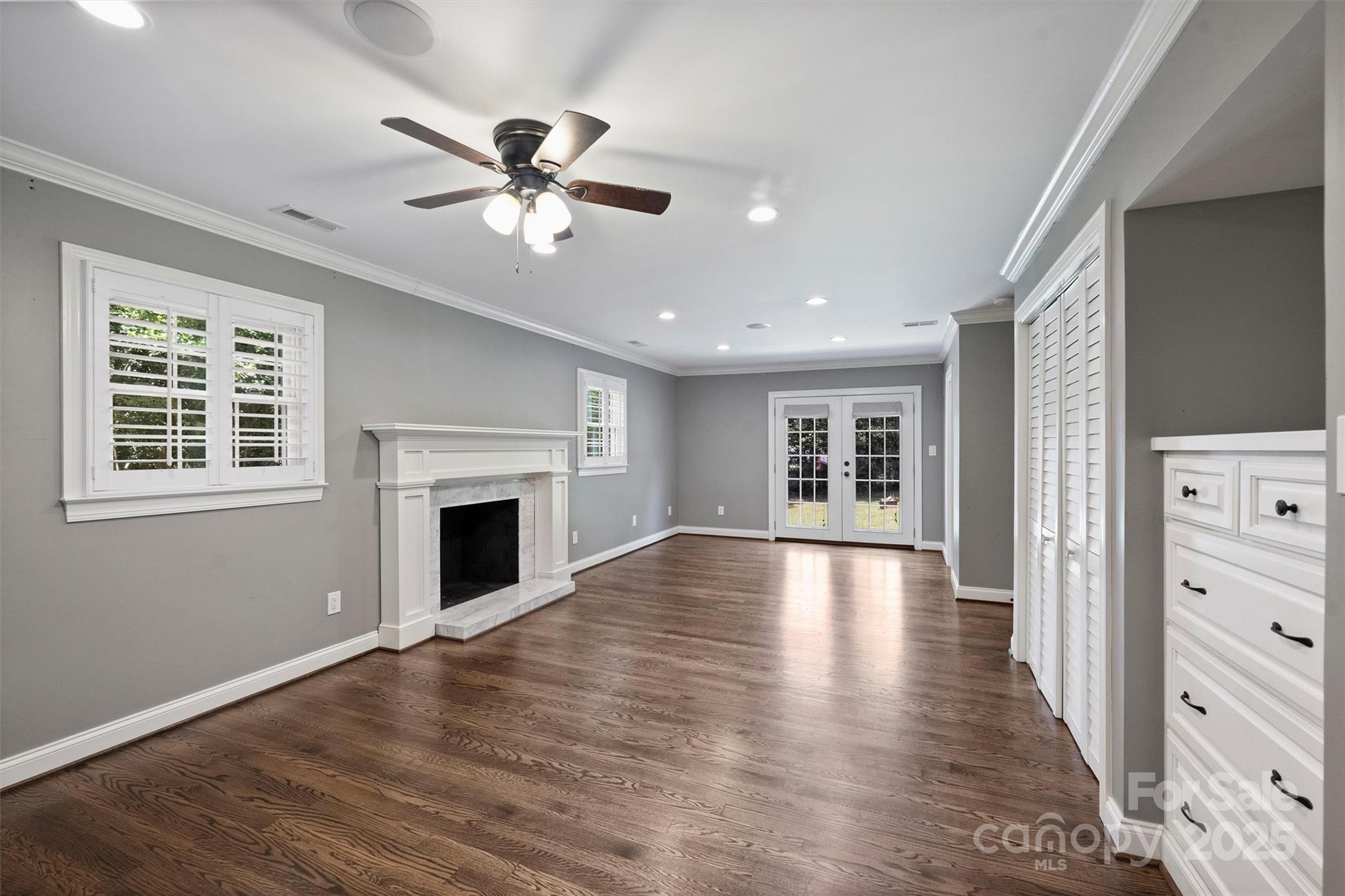 1008 Dumbarton Road Gastonia, NC 28054 - Photo 22 of 40 a view of an empty room with wooden floor fireplace and a window