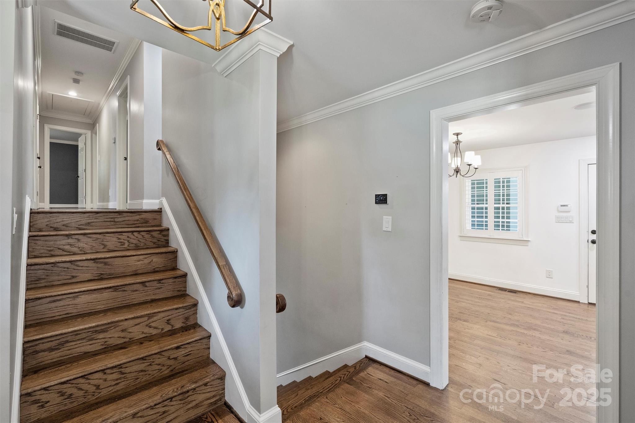 1008 Dumbarton Road Gastonia, NC 28054 - Photo 5 of 40 a view of a hallway with wooden floor and entryway