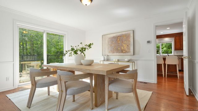 a view of a dining room with furniture window and outside view