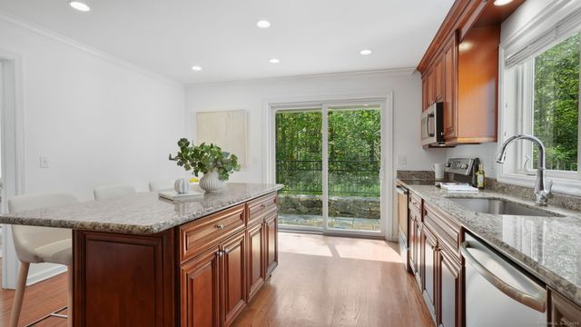 a kitchen with sink and cabinets