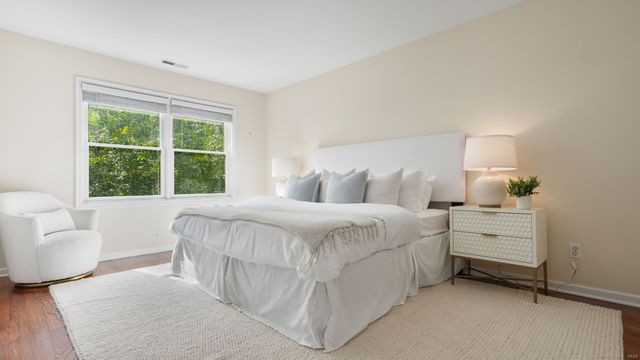 a bedroom with a bed and a couch