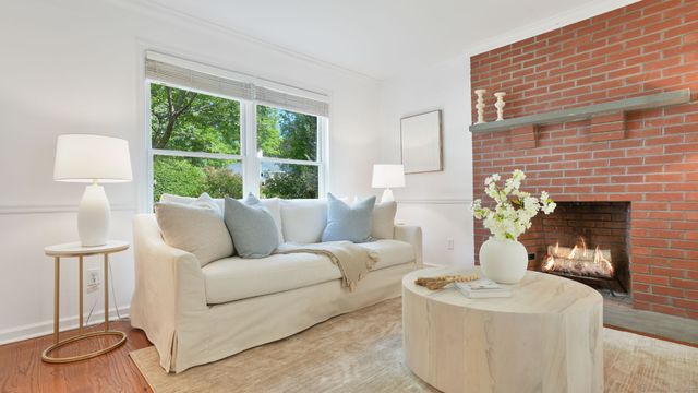 a living room with furniture and a lamp