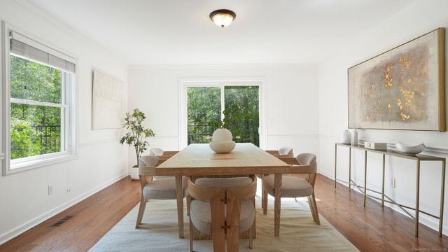 a view of a dining room with furniture window and outside view