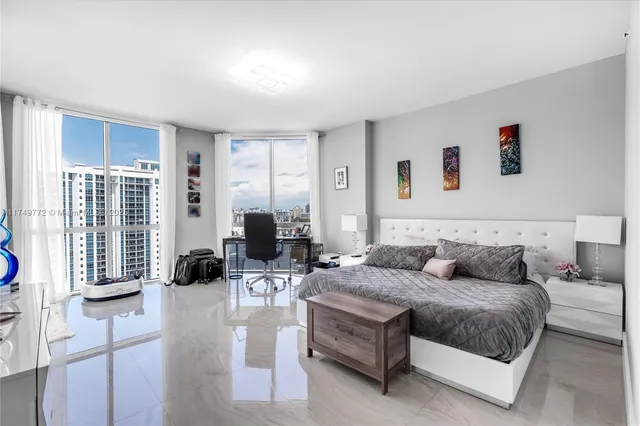 a bathroom with a toilet a sink and a mirror