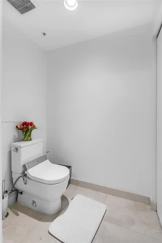 a lake view with tables and chairs