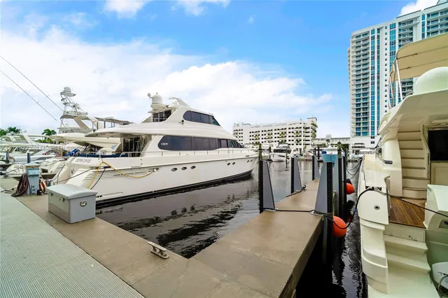 a view of a park with a slide and potted plants