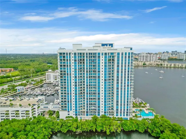 a view of an entryway with a flower pot and a living room