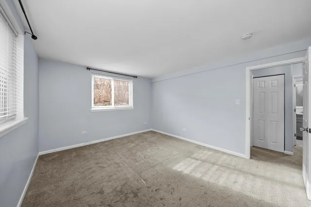 a view of a house with brick walls