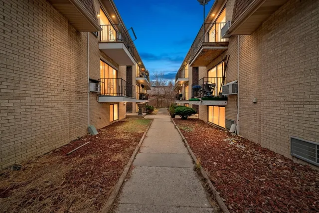 a view of a living room and workspace