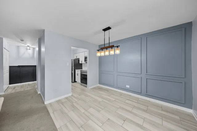 a view of a livingroom with a kitchen