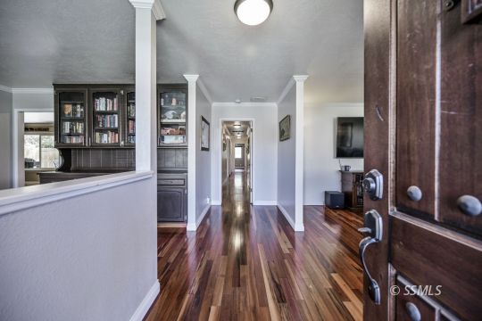 725 West Howell Avenue Ridgecrest, CA 93555 - Photo 4 of 35 a view of a room with wooden floor and furniture