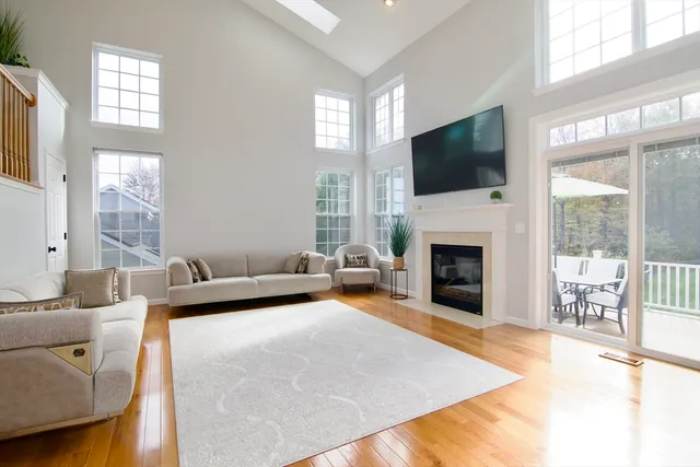 a living room with furniture fireplace and flat screen tv