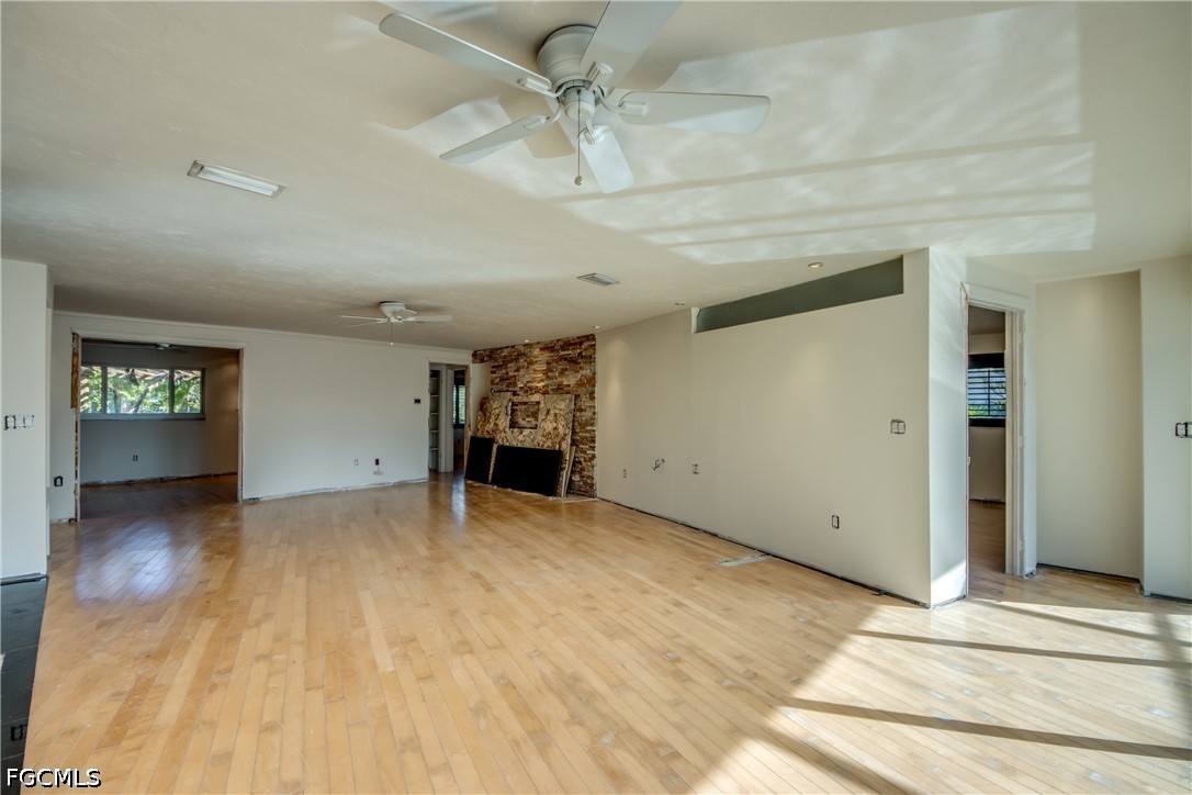 2701 Bruce Street Matlacha, FL 33993 - Photo 18 of 47 a view of an empty room with window and wooden floor