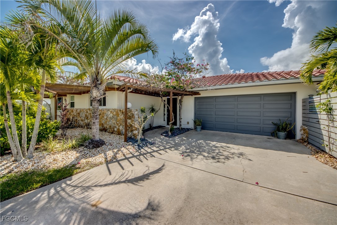 2701 Bruce Street Matlacha, FL 33993 - Photo 2 of 47 a view of a house with a patio