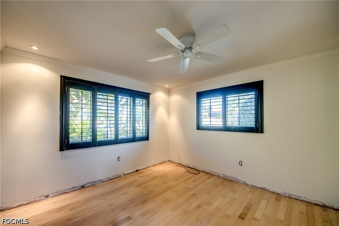 2701 Bruce Street Matlacha, FL 33993 - Photo 29 of 47 a view of an empty room with wooden floor and a window