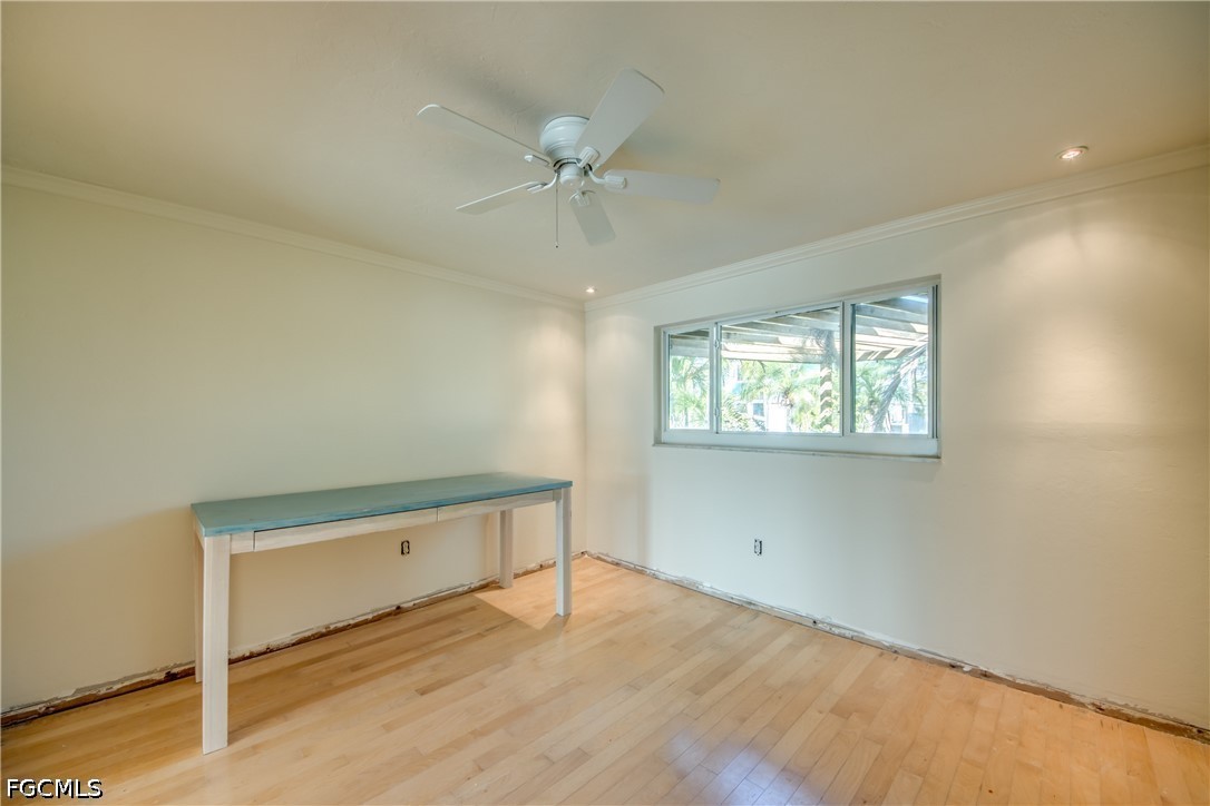 2701 Bruce Street Matlacha, FL 33993 - Photo 33 of 47 an empty room with a window and ceiling fan
