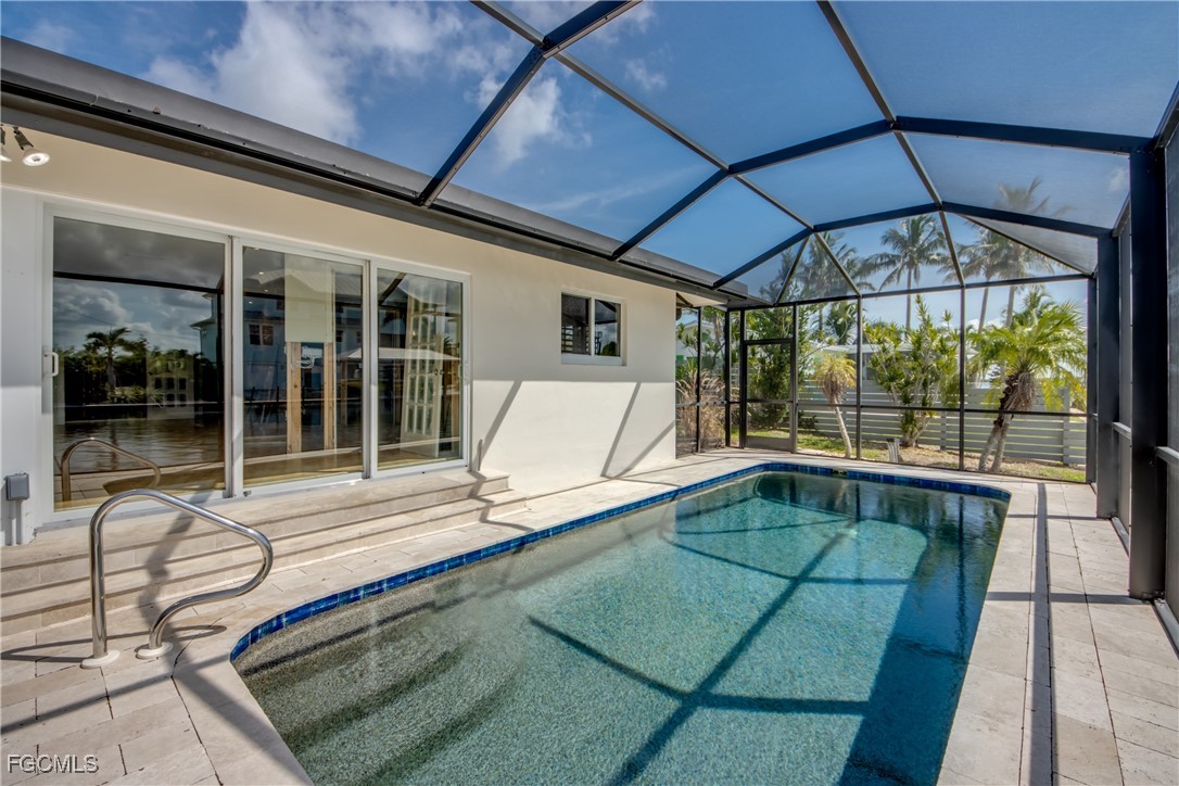 2701 Bruce Street Matlacha, FL 33993 - Photo 38 of 47 a swimming pool with outdoor seating