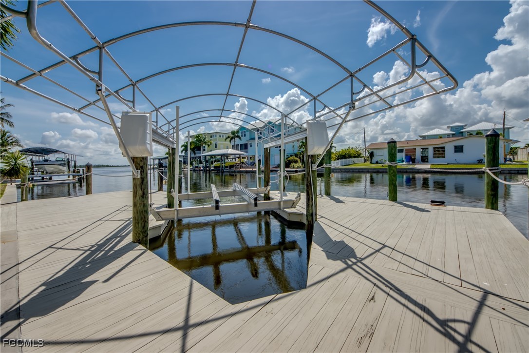 2701 Bruce Street Matlacha, FL 33993 - Photo 45 of 47 a view of a patio with table and chairs under an umbrella
