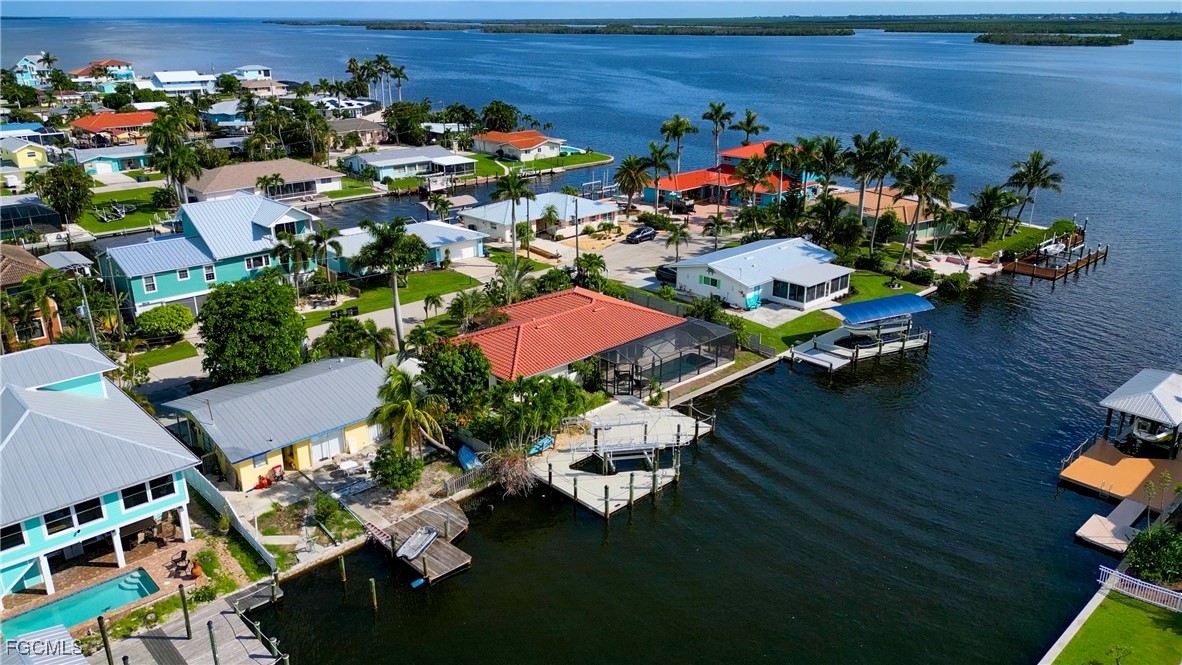 2701 Bruce Street Matlacha, FL 33993 - Photo 8 of 47 an aerial view of a house yard swimming pool and outdoor seating