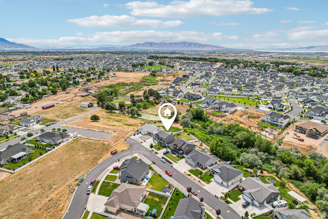 203 North 1900th Street West Mapleton, UT 84664 - Photo 46 of 48 Aerial perspective showcasing a residential neighborhood with mountain backdrop