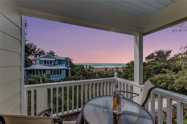a view of a livingroom with furniture and staircase