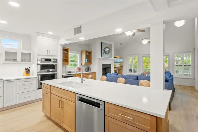 a bedroom with a bed and a window with wooden floor
