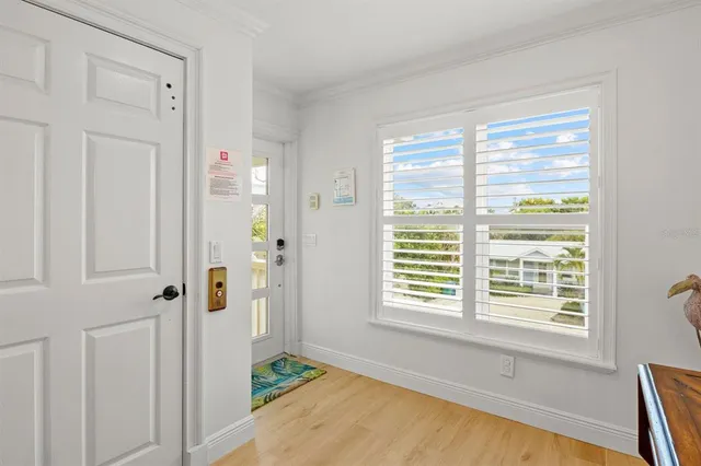 a living room with furniture a fireplace and a kitchen