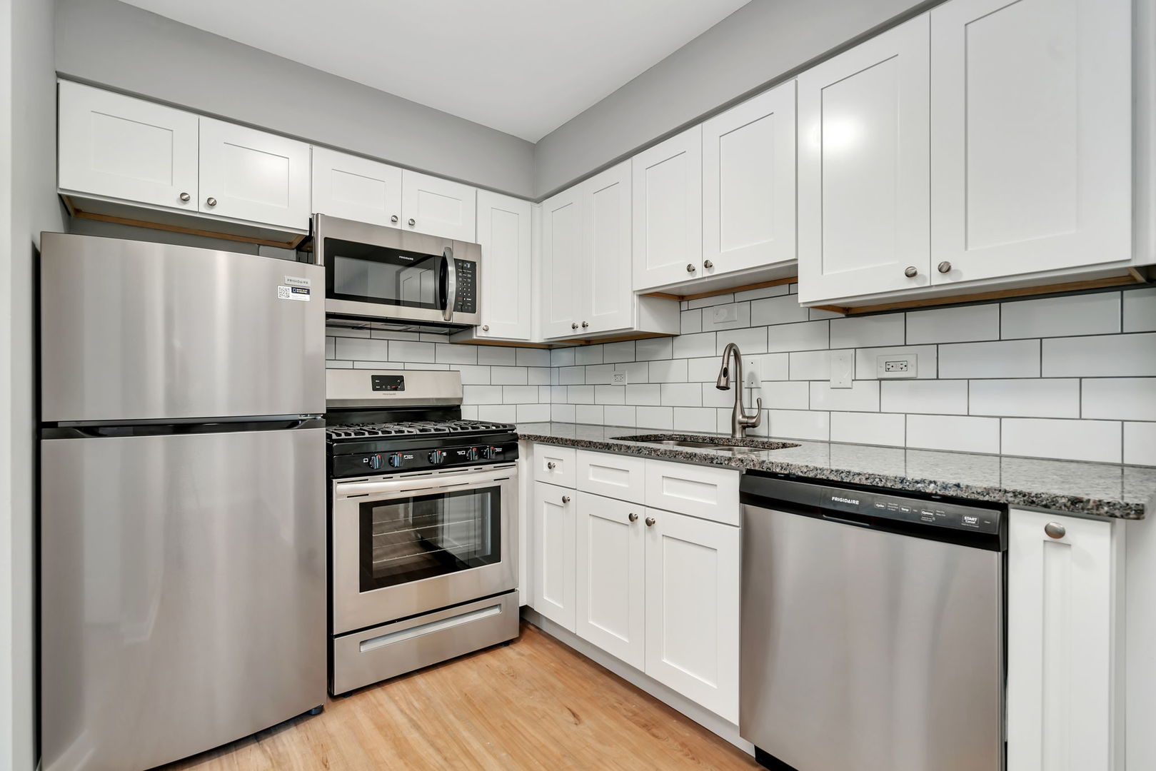 909 Plainfield Road, Unit 12 Darien, IL 60561 - Photo 4 of 10 a kitchen with stainless steel appliances a refrigerator sink and cabinets