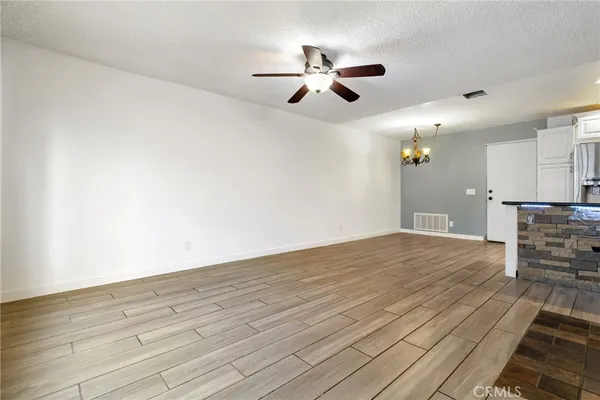 a view of a livingroom with a fireplace and window