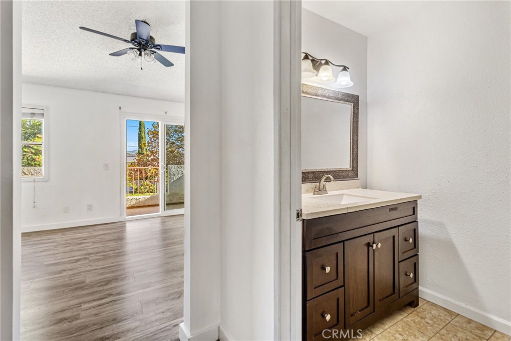 12411 Osborne Street, Unit 2 Pacoima, CA 91331 - Photo 19 of 37 a bathroom with a sink a vanity and a mirror