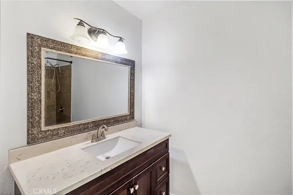 a white toilet sitting next to a bathroom sink