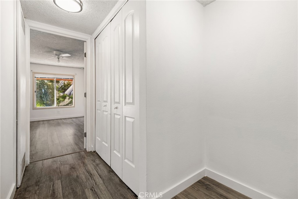 12411 Osborne Street, Unit 2 Pacoima, CA 91331 - Photo 23 of 37 a view of an empty room with wooden floor and a window