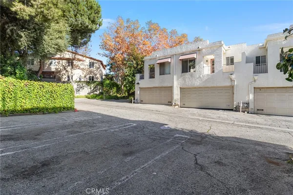 a view of a house with a road
